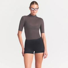 NikeSKIMS WEIGHTLESS LAYERS MOCK NECK SHORT SLEEVE T-SHIRT | BOULDER ON A MODEL SIDE VIEW @ | FOCUS: 0.0, 1.0, 0.9