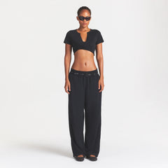 NikeSKIMS PERFORMANCE COTTON BLEND CROP TWIST TANK | OBSIDIAN ON A MODEL FRONT VIEW @ | FOCUS: 0.0, 1.0, 0.9
