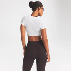 NikeSKIMS PERFORMANCE COTTON BLEND SHORT SLEEVE V-NECK TOP | SNOW ON A MODEL SIDE VIEW @ | FOCUS: 0.0, 1.0, 0.9