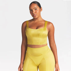 NikeSKIMS SATIN SHINE PANELED SCOOP TANK | CITRINE ON A MODEL SIDE VIEW @ | FOCUS: 0.0, 1.0, 0.9