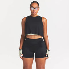 NikeSKIMS PERFORMANCE COTTON BLEND CROP TANK | OBSIDIAN ON A MODEL SIDE VIEW @ | FOCUS: 0.0, 1.0, 0.9