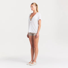 NikeSKIMS PERFORMANCE COTTON BLEND SHORT SLEEVE V-NECK TOP | SNOW ON A MODEL FRONT VIEW @ | FOCUS: 0.0, 1.0, 0.9