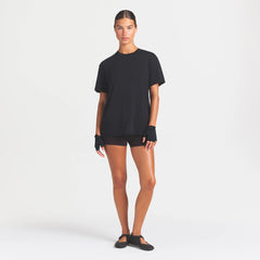 NikeSKIMS PERFORMANCE COTTON BLEND OVERSIZED SHORT SLEEVE TOP | OBSIDIAN ON A MODEL FRONT VIEW @ | FOCUS: 0.0, 1.0, 0.9