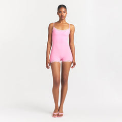 FITS EVERYBODY LACE ONESIE | BUBBLE GUM TONAL ON A MODEL FRONT VIEW @ | FOCUS: 0.0, 1.0, 0.9