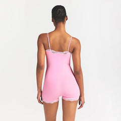 FITS EVERYBODY LACE ONESIE | BUBBLE GUM TONAL ON A MODEL BACK VIEW @ | FOCUS: 0.0, 1.0, 0.9
