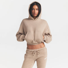 COTTON FLEECE CROPPED HOODIE | LATTE ON A MODEL SIDE VIEW @ | FOCUS: 0.0, 1.0, 0.9