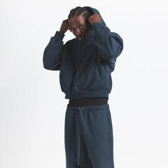 HEAVYWEIGHT FLEECE MENS HOODIE | NAVY ON A MODEL SIDE VIEW @ | FOCUS: 0.0, 1.0, 0.9