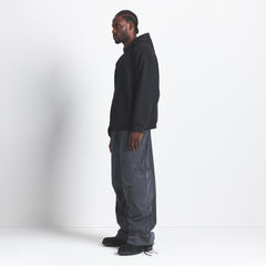 FLEECE LOUNGE MENS RELAXED HOODIE | WASHED ONYX ON A MODEL SIDE VIEW @ | FOCUS: 0.0, 1.0, 0.9