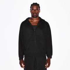 FLEECE LOUNGE MENS RELAXED ZIP UP HOODIE | WASHED ONYX ON A MODEL SIDE VIEW @ | FOCUS: 0.0, 1.0, 0.9
