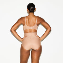 SKIMS BODY CORE SCULPT BUTT LIFTING BRIEF | SIENNA ON A MODEL SIDE VIEW @