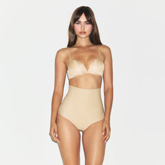 SKIMS BODY CORE SCULPT BUTT LIFTING BRIEF | SAND ON A MODEL SIDE VIEW @