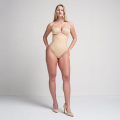SKIMS BODY CORE SCULPT HIGH-WAISTED THONG | SAND ON A MODEL FRONT VIEW
