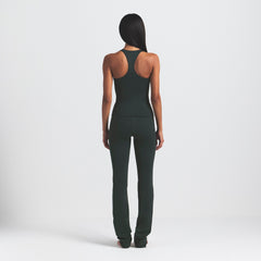 NikeSKIMS MATTE V-LINE 39" STRAIGHT LEGGING | DARK TEAL ON A MODEL SIDE VIEW @ | FOCUS: 0.0, 1.0, 0.9