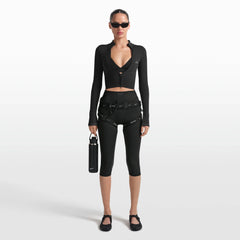 NikeSKIMS MATTE 17" V-LINE CROP LEGGING | OBSIDIAN ON A MODEL FRONT VIEW @ | FOCUS: 0.0, 1.0, 0.9