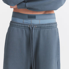 HEAVYWEIGHT FLEECE MENS JOGGER | KYANITE ON A MODEL SIDE VIEW @ | FOCUS: 0.0, 1.0, 0.9