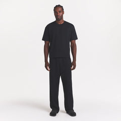 HEAVYWEIGHT COTTON MENS RELAXED PANT | OBSIDIAN ON A MODEL FRONT VIEW