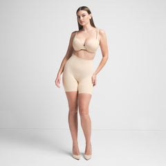 SEAMLESS SCULPT BUTT LIFTING SHORT | SAND ON A MODEL FRONT VIEW