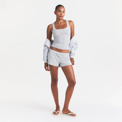 COTTON JERSEY LOOSE SHORT | LIGHT HEATHER GREY ON A MODEL FRONT VIEW @ | FOCUS: 0.0, 1.0, 0.9