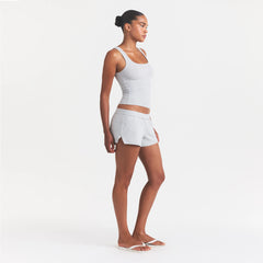 COTTON JERSEY LOOSE SHORT | LIGHT HEATHER GREY ON A MODEL FRONT VIEW @ | FOCUS: 0.0, 1.0, 0.9