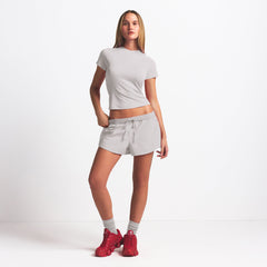 NikeSKIMS WOVEN NYLON 2.5" RUNNER SHORT | STONE ON A MODEL FRONT VIEW @ | FOCUS: 0.9, 0.1, 0.7