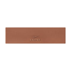 NikeSKIMS ACCESSORIES HEADBAND | CAROB BROWN & LAYS FLAT ON A WHITE BACKGROUND | FLT