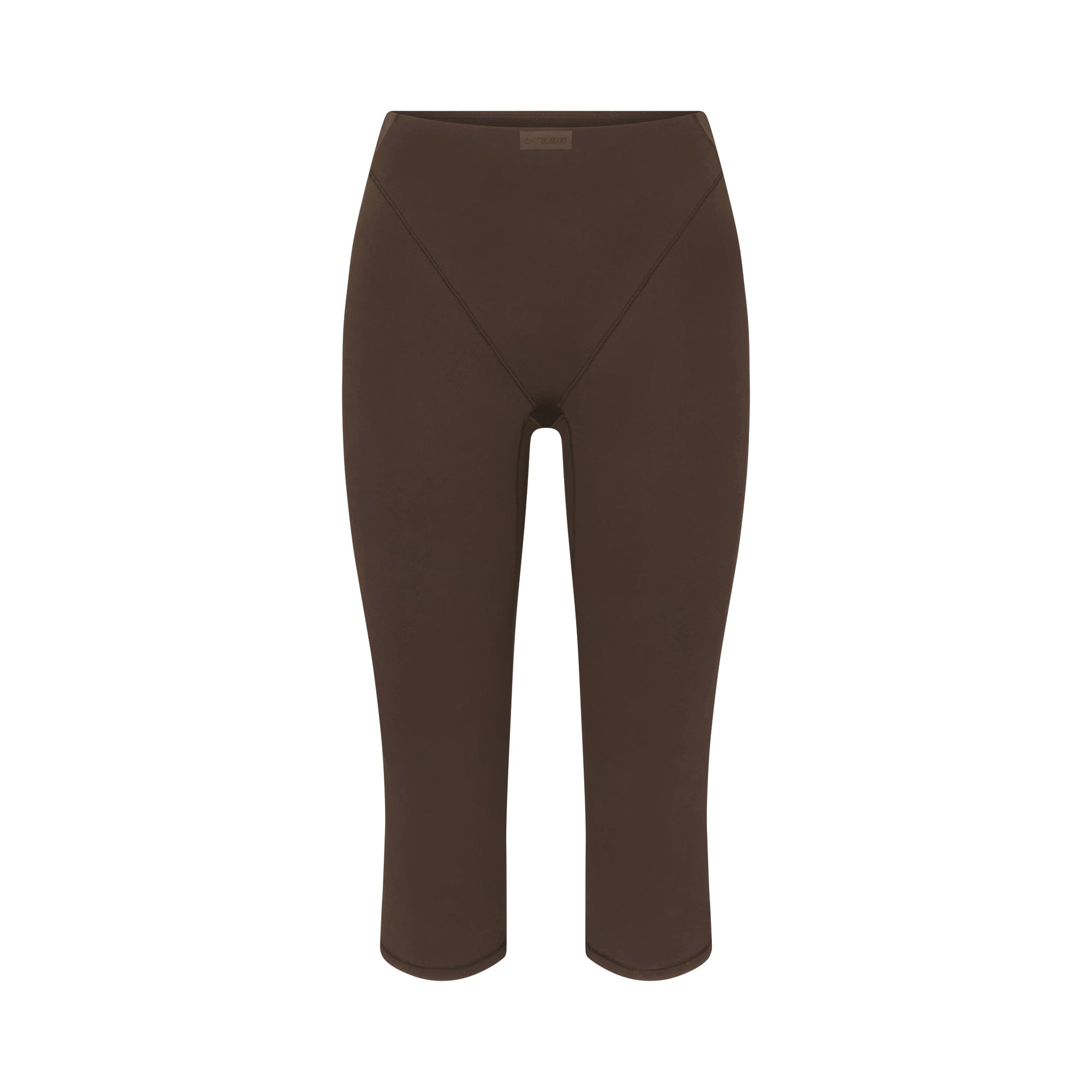 NikeSKIMS MATTE 17" V-LINE CROP LEGGING | DARK SEPIA FLAT ON A WHITE BACKGROUND | FLT