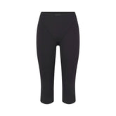 NikeSKIMS MATTE 17" V-LINE CROP LEGGING | OBSIDIAN FLAT ON A WHITE BACKGROUND | FLT