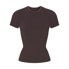 NikeSKIMS RIBBED SEAMLESS BABY TEE | PHOENIX/TRUFFLE FLAT ON A WHITE BACKGROUND | FLT