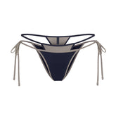 SIGNATURE SWIM LAYERED TIE SIDE BIKINI BOTTOM | NAVY CONTRAST LAYS FLAT ON A WHITE BACKGROUND | FLT