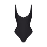 SKIMS BODY UNLINED PLUNGE THONG BODYSUIT | ONYX (SHAPEWEAR BODYSUITS, SHAPEWEAR) LAYS FLAT ON A WHITE BACKGROUND | FLT