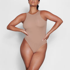 ON A MODEL FRONT VIEW FITS EVERYBODY HIGH NECK BODYSUIT IN SIENNA