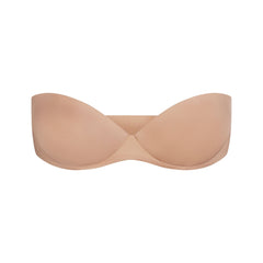 SKIMS ULTIMATE BRA STRAPLESS PUSH-UP BRA | CLAY (PUSH-UP BRAS) LAYS FLAT ON A WHITE BACKGROUND | FLT