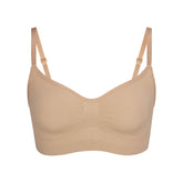 SEAMLESS SCULPT BRALETTE | CLAY (SHAPEWEAR BRALETTES, BRAS) LAYS FLAT ON A WHITE BACKGROUND | FLT