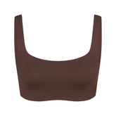 NikeSKIMS MATTE SCOOP NECK BRA | DARK SEPIA FLAT ON A WHITE BACKGROUND | FLT