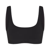 NikeSKIMS VINTAGE SEAMLESS SCOOP NECK BRA | OBSIDIAN FLAT ON A WHITE BACKGROUND | FLT