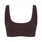 NikeSKIMS VINTAGE SEAMLESS SCOOP NECK BRA | PHOENIX FLAT ON A WHITE BACKGROUND | FLT