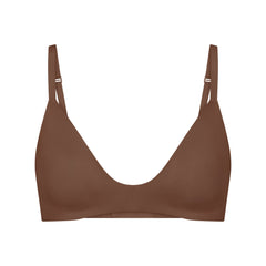 WIRELESS FORM T-SHIRT DEMI BRA | JASPER (DEMI BRAS) LAYS FLAT ON A WHITE BACKGROUND | FLT