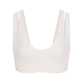 NikeSKIMS MATTE DOUBLE STRAP SCOOP BRA | IVORY LAYS FLAT ON A WHITE BACKGROUND | FLT