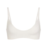 NikeSKIMS MATTE MICRO SCOOP BRA | IVORY LAYS FLAT ON A WHITE BACKGROUND | FLT