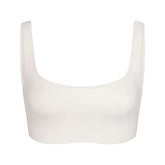 NikeSKIMS MATTE SCOOP NECK BRA | IVORY LAYS FLAT ON A WHITE BACKGROUND | FLT