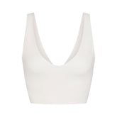 NikeSKIMS MATTE V-NECK BRA TOP | IVORY LAYS FLAT ON A WHITE BACKGROUND | FLT
