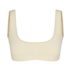 NikeSKIMS RIBBED SEAMLESS MICRO SCOOP BRA | LEMON DROP & LAYS FLAT ON A WHITE BACKGROUND | FLT