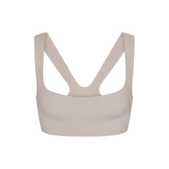 NikeSKIMS STUDIO STRETCH RACER BACK BRA | LINEN LAYS FLAT ON A WHITE BACKGROUND | FLT
