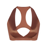 NikeSKIMS SATIN SHINE RACERBACK BRA | CAROB BROWN & LAYS FLAT ON A WHITE BACKGROUND | FLT