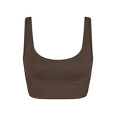 NikeSKIMS MATTE CORSET LONGLINE BRA | DARK SEPIA LAYS FLAT ON A WHITE BACKGROUND | FLT