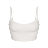 NikeSKIMS MATTE CAMI BRA TOP | IVORY LAYS FLAT ON A WHITE BACKGROUND | FLT