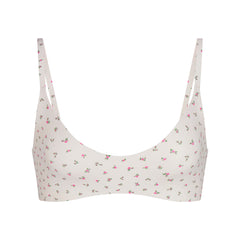 NikeSKIMS MATTE MICRO SCOOP BRA | DITSY FLORAL PRINT LAYS FLAT ON A WHITE BACKGROUND | FLT