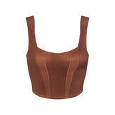 NikeSKIMS SATIN SHINE PANELED SCOOP TANK | CAROB BROWN & LAYS FLAT ON A WHITE BACKGROUND | FLT