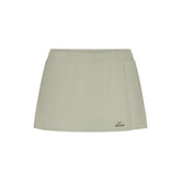 NikeSKIMS STRETCH NYLON SKORT | TALC & LAYS FLAT ON A WHITE BACKGROUND | FLT