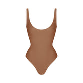 SKIMS BODY SCOOP LOW BACK THONG BODYSUIT | JASPER FLAT ON A WHITE BACKGROUND | FLT